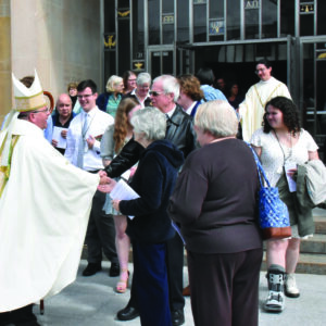 Bishop Bonnar greeting people outside Cathedral of St. Columba. Photo by Robert Zajack.