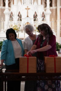 Copyists sealing boxes of documents from the Diocesan Investigation to send to the Congregation for the Causes of Saints